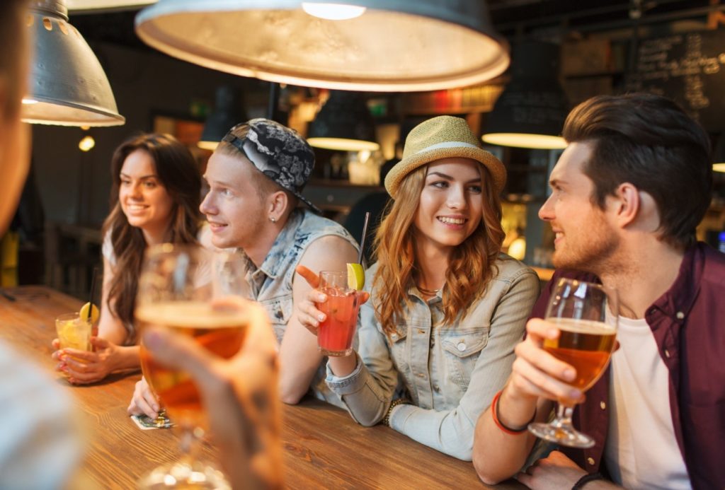 young people drinking at bar