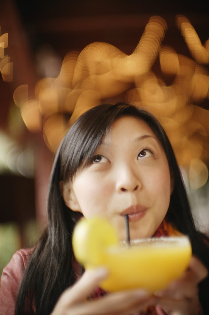 young looking girl drinking alcohol