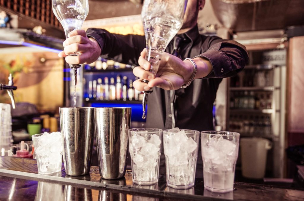 bartender making drinks for guests